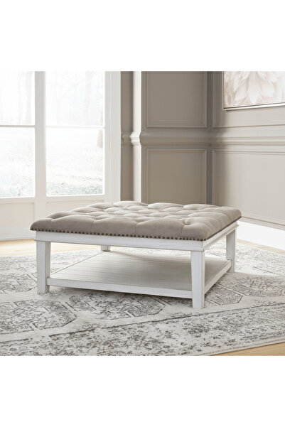 Ashley Furniture طاولة قهوة أتومان مبطنة من كانوين