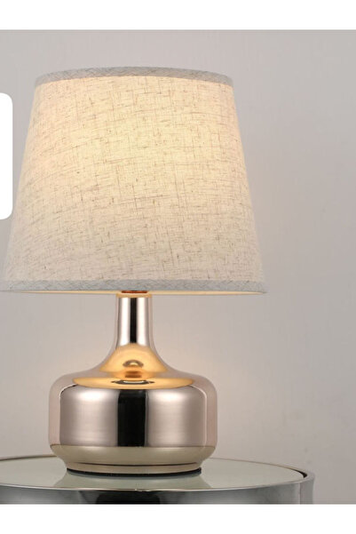 Generic Modern Design Table Lamp Featuring a Metallic Base in a Shiny Gold Fi...