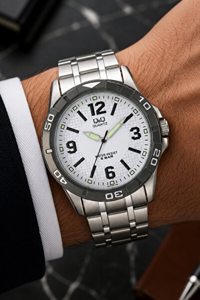 Q&Q Men's Silver Metal Cord White Dial 5 Bar Wristwatch with 2 Year Warranty