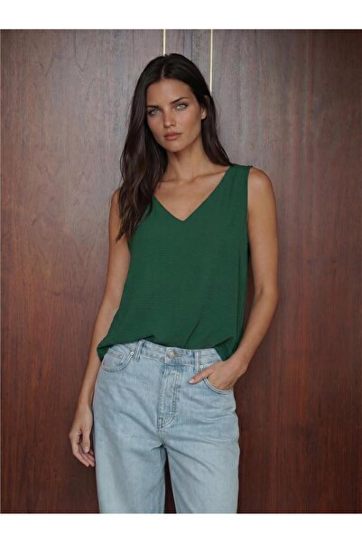 WeShaya Emerald Green Flexible Textured V-Neck Zero Sleeve Regular Cut Plain ...