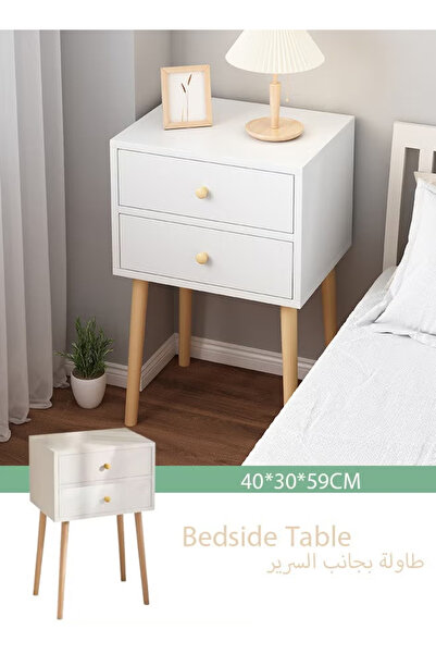 table طاولة سرير بيضاء بتصميم بسيط مع مساحة تخزين وأرجل من الخشب الصلب، ومناس...