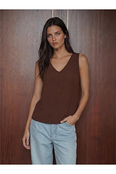 WeShaya Brown Flexible Textured V-Neck Zero Sleeve Regular Cut Casual Blouse