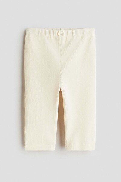 H&M بنطال ضيق من المخمل المضلع