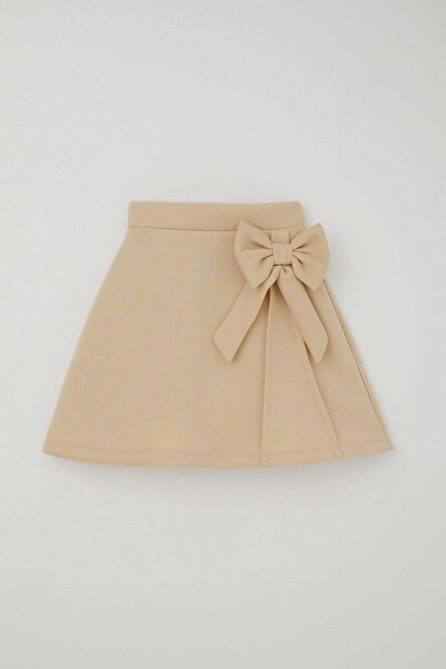Breeze Fusta pentru fete cu accesoriu fundita, talie elastica, 6-12 ani, crem