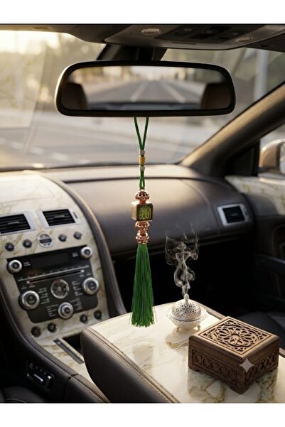 Basmmt Imtiaz A car decoration pendant with four different designs.