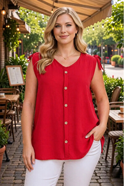 tarzımsüper Γυναικεία υφασμάτινη μπλούζα Aerobin με λεπτομέρεια αμάνικη κουμπιά