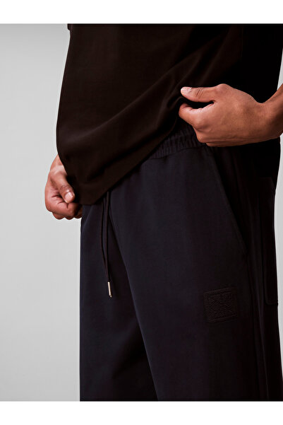 Calvin Klein بنطلونات رياضية للرجال