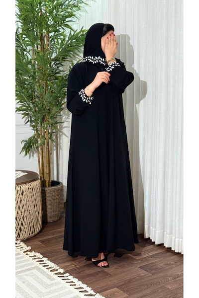 Ms Royal Abaya with a Straight Cut and Leaf-Patterned Hem.