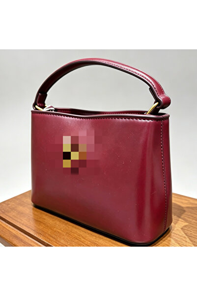 Bleco Simple commuter handbag with a small water bucket.