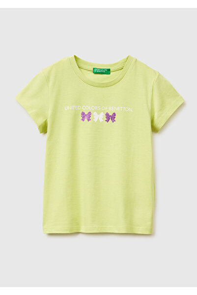 United Colors of Benetton تي شيرت بناتي أصفر اللون مزين برسومات لامعة وطباعة ...