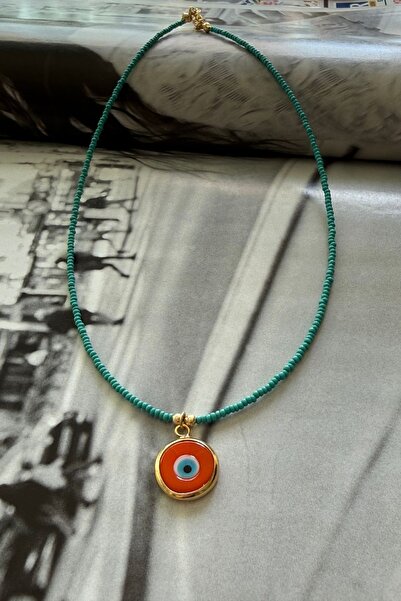 Trendy Butik Turquoise beaded orange eye necklace