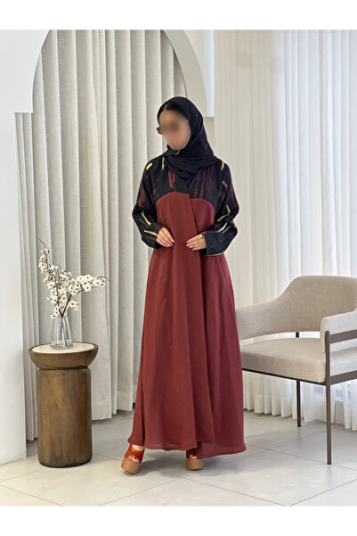 elegant veil Abaya Nov Lenn in a Straight Cut with a Ruffled Hem.