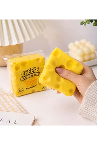 Squeeze Squishy toy in the shape of a yellow Swiss cheese slice