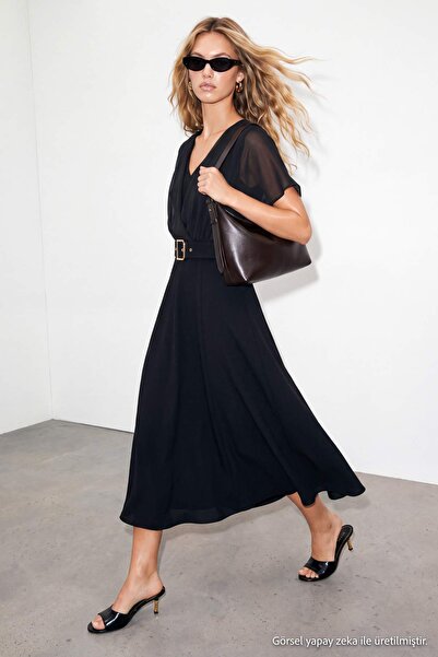 Drop by TrendyolMilla فستان أسود بدون أكمام من الشيفون بياقة على شكل حرف V مع...
