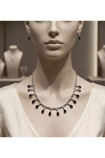 twingold طقم أقراط بتصميم مفصل على شكل قطرات لامعة ليلاً