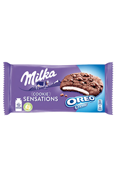 Milka Biscuiti de cacao cu bucati de ciocolata si umplutura cu aroma de vanil...