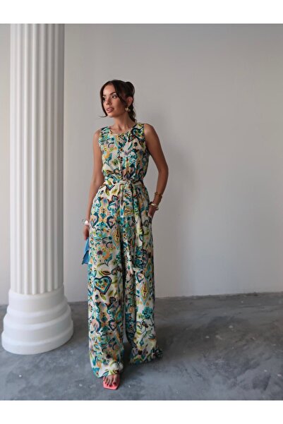 Butik Mavi Karışık Desenli Gizli Fermuar Kuşaklı Bol Paça Tulum