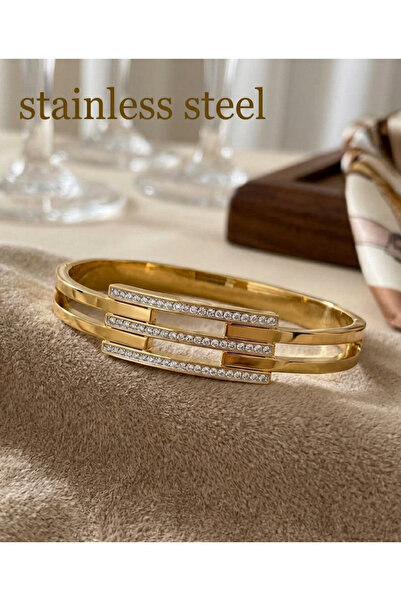 stainless steell سوار فولاذي ذهبي اللون