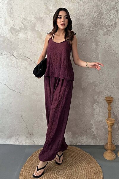 Clothes Fast طقم بلوزة وبنطلون نسائي بياقة هالتر وتفاصيل مزخرفة وأرجل واسعة
