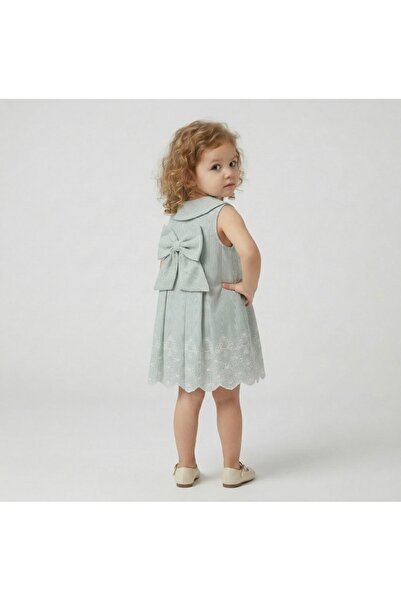 Alvadonna Mint Color Girls' Dress with Pearl Buttons on the Front, a Bow on the Back, and a Festive Detail at the Skirt.