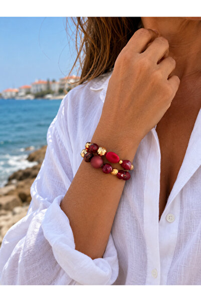 COCOSH TAKI Burgundy red chunky beaded multi-strand bracelet with gold accents.