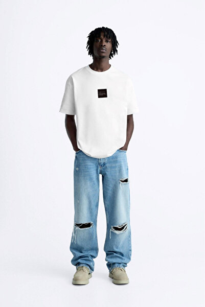 STYKEER Unisex Oversized T-Shirt the Champ Printed Black / White