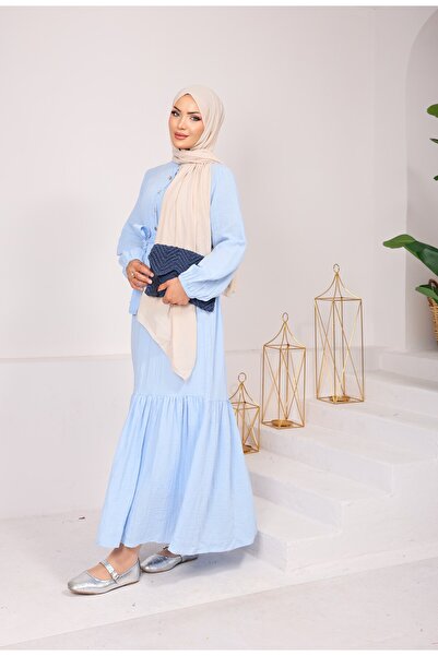 MODA 1993 MÜSLİN KUMAŞ SEYYAR KEMERLİ YARIYA KADAR DÜĞMELİ ELBİSE BEBE MAVİSİ