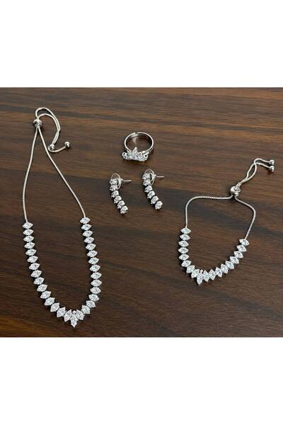 stainles steel طقم اكسسوار فضي فخم للمناسبات مكون من سلسال وحلق واسورة يد وخاتم