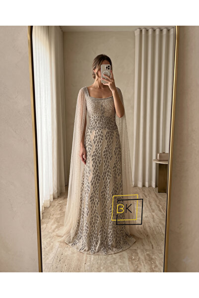 Generic Royal Evening Gown Full of Glittering Leaf Motifs with a Cascading Tu...