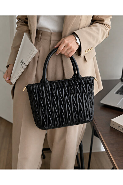 Bags Italia Elegant black quilted women's bag with round handle