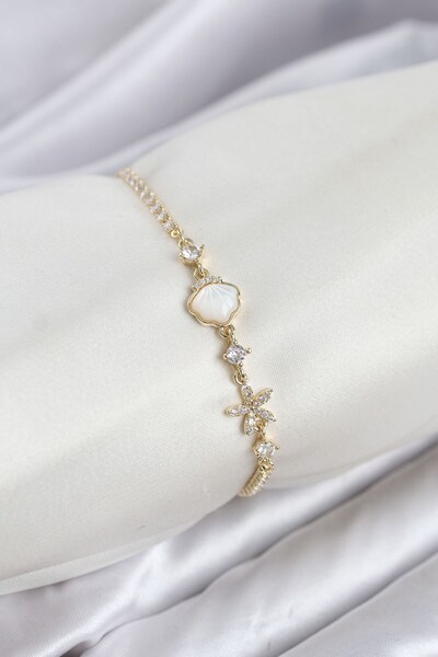 Inure Jewelry سوار نسائي من النحاس الذهبي اللون بتصميم صدفة البحر مع رافعة