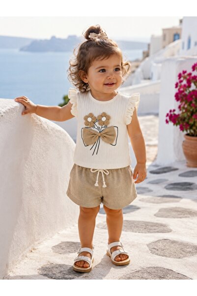Pure Boutique Girls' summer outfit with beige shorts and blouse with floral bow