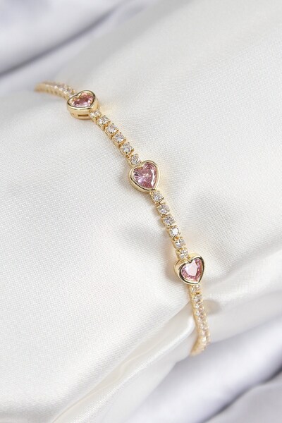 Inure Jewelry سوار نسائي من النحاس والزركون الوردي على شكل قلب ذهبي اللون