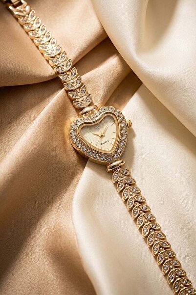GANYMET Calbis Women's Gold Heart Case Steel Watch Stone Embellished Leaf Pat...