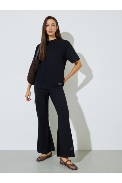 Styli Black Badge Detail T-Shirt and Flared Leggings Co-Ords
