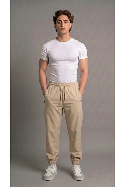 bgm fashion Unisex bež padobranske pantalone sa džepovima i elastičnim nogavi...