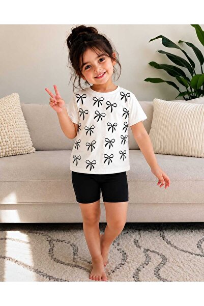 Kids طقم شورت صيفي من قطعتين باللونين الأسود والأبيض بنمط فيونكة للفتيات