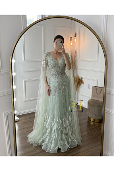 Generic Royal Evening Dress with Beaded Cape Sleeves and Feathered Accents