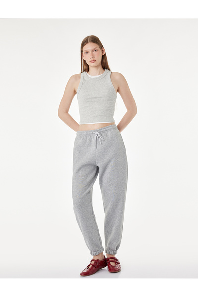 Koton Pantaloni de trening jogger cu detaliu din sclipici, cu trei fire, tali...