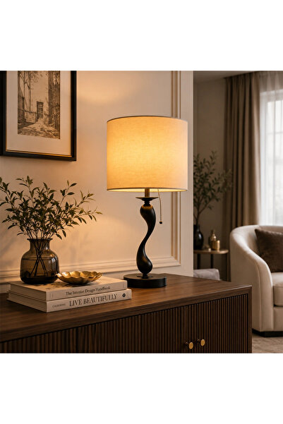 Mily Modern table lamp with a sleek black body and warm lighting