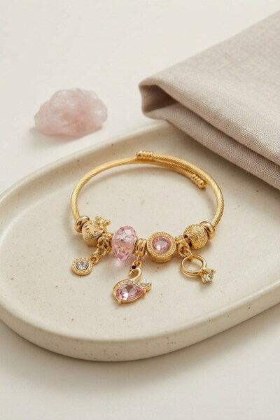 Inure Jewelry سوار ذهبي اللون على شكل بجعة وردية