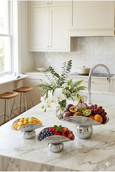 Generic A set of dessert and fruit serving dishes with a luxurious decorative...