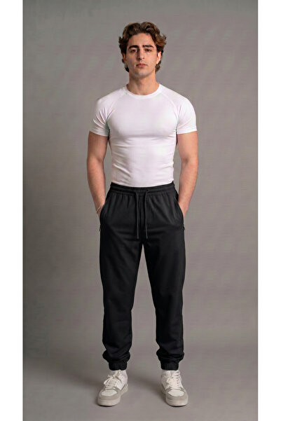 bgm fashion Unisex crne padobranske pantalone sa džepovima i elastičnim manže...