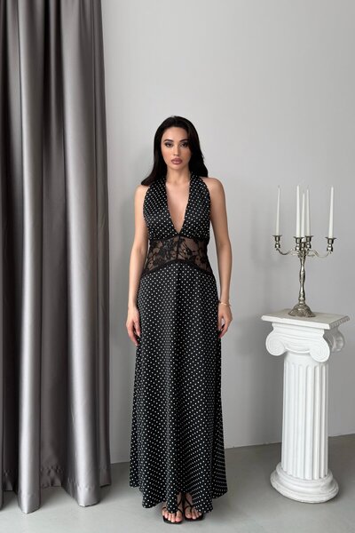 Serica Moda فستان أسود منقط بتفاصيل شفافة عند الخصر وياقة هالتر