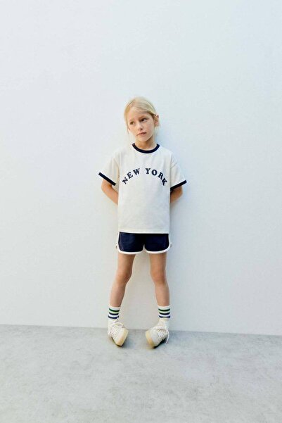 Leni Kids تي شيرت أبيض مطبوع باللون الأزرق الداكن للفتيات من La'ciel Paris، ط...