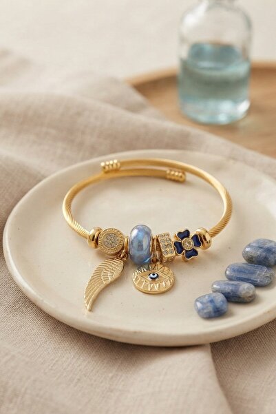 Inure Jewelry سوار ذهبي اللون مزين بحلية على شكل عين زرقاء