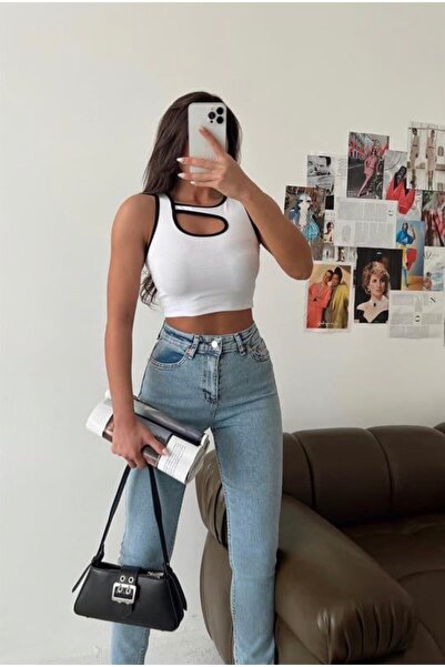 MODA The camisole fabric blouse with window detail is of first quality.