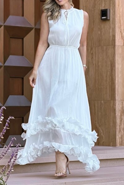 Suziş ETEĞİ VOLANLI PARLAK KUMAŞ KOLSUZ UZUN ELBİSE M39908