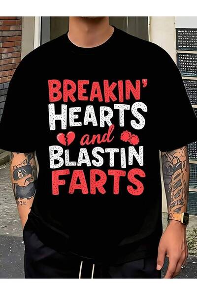 01THEONE تي شيرت رجالي بطباعة مضحكة لعيد الحب بتصميم "Breaking Hearts Blastin...