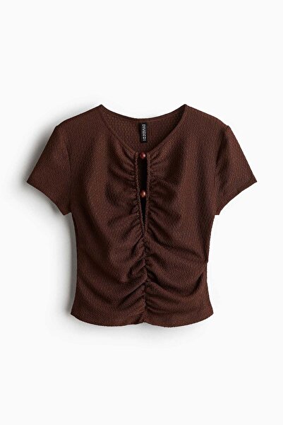 H&M بلوزة مزينة بالخرز ومكشكشة